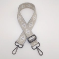 Macro detail of adjustable striped bag strap with diamond weave and grey metal hooks - Grey Silver Thread Diamond + Gunmetal Hook