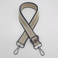 Close-up of adjustable striped bag strap with gunmetal lobster clasps and metallic weave - Khaki Gold Twist + Gunmetal Hook