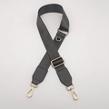Close-up of adjustable dark gray nylon shoulder strap with gold lobster clasps and D-ring - Dark Gray