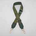 Close-up of olive green nylon strap with gold metal hooks and adjustable buckle - Army Green with Army Green Leather