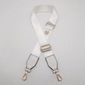 Close-up of adjustable white nylon strap with gold metal swivel clasps and hardware - White with White Leather
