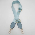 Detail of light blue nylon strap with gold lobster clasps and D-ring attachment - Light Blue with Light Blue Leather