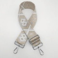 Close-up of ethnic woven nylon bag strap with geometric patterns and silver metal hooks - Beige and Off-White with Silver Thread and Silver Hook