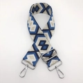 Close-up of geometric ethnic pattern nylon bag strap with silver metal lobster clasps - Blackish Blue with Light Gold Thread and Silver Hook