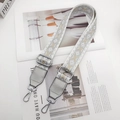 Close-up of adjustable wide shoulder strap with silver geometric embroidery and metal clips - Double Side Silver Arrow Style