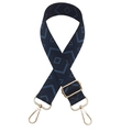 Detail of adjustable geometric diamond pattern bag strap with gold lobster clasps - Black with Blue