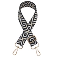 Close-up of geometric patterned woven replacement shoulder strap with gold metal hardware - Black with Off-white