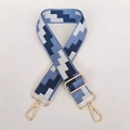 Detail of adjustable blue pixel weave canvas bag strap with gold metal lobster clasps - Lake Blue