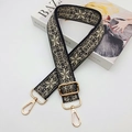 Close-up of bohemian floral jacquard strap with gold hardware on fashion magazine - Grey With Black Base