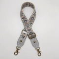 Detail of bohemian jacquard woven bag strap with bronze metal swivel hooks and leather ends - Style 11 Grey Leather