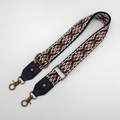 Close-up of ethnic geometric pattern strap with bronze lobster clasps and buckles - No.14 Black Leather