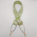Close-up of adjustable wide canvas bag strap with green and beige geometric V-pattern - Fluorescent Green + White Leather