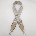 Detail of adjustable woven canvas strap with wave pattern and gold metal buckles - Dark Khaki Apricot White + Khaki Leather
