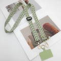 Cordón para móvil cruzado con patrón de hojas verdes y colgante de perla blanca - verde claro