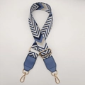 Detail of adjustable wide canvas shoulder strap with blue geometric chevron patterns - Blue + Lake Blue Leather