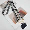 Cordón ajustable beige para móvil con patrón de hojas negras y herrajes dorados - Negro