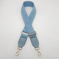 Detail of light blue adjustable canvas shoulder strap with gold metal buckles and leather ends - Light Blue + Light Blue Leather