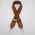 Detailed view of brown woven bag strap with golden metal swivel hooks and leather ends - Brown + Brown Leather