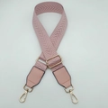 Close-up of pink herringbone woven strap with golden swivel metal hooks and leather detail - Sakura Pink with Pink Leather