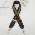 Detail view of ethnic jacquard woven shoulder strap with gold metal hooks and PU leather - Black Coffee Edge Brown + Coffee Leather
