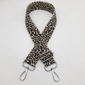 Detail of adjustable leopard print bag strap with silver metal swivel hooks and buckles - Khaki Yellow + Silver Hook