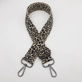 Detail of leopard print woven strap with gunmetal lobster clasps and adjustable buckle - Khaki Yellow + Gunmetal Hook
