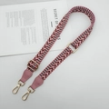 Close-up of pink wave pattern shoulder strap with gold metal buckle and leather ends - Petal Pink (Gold Hook)