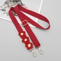 Detail of red woven bag strap featuring three 3D crochet flowers and gold hardware hooks - Red With Gasket