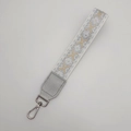Adjustable silver ethnic pattern jacquard strap with grey leather ends and metal buckle - Double Silver Arrow (Handheld)