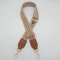 Detail of adjustable woven shoulder strap with brown chevron pattern and gold metal hooks - Brown (Brown Leather)