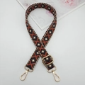 Close-up of a 2.5cm geometric diamond woven strap with premium gold metal hardware - Orange Blue Coffee