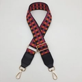 Detail of adjustable checkered bag strap with orange and purple patterns and gold metal clips - Black Orange Rose + Black Leather