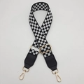 Detail of adjustable black and white checkerboard guitar strap with gold metal hooks - Black and White with Black Leather