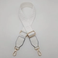 Detail of white wide adjustable crossbody bag strap with geometric jacquard and gold hooks - White / Gold
