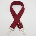 Detail of burgundy geometric rhombus woven strap with gold metal buckle and hooks - Burgundy
