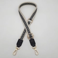 Detail of adjustable woven strap with beige and black chevron pattern and gold metal hooks - Cream Edge Grey Black + Black Leather