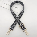 Close-up of geometric jacquard woven bag strap with golden metal swivel hooks - Dark Gray