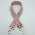 Close-up of pink geometric diamond weave pattern and adjustable gold metal buckle on strap - Sakura Pink