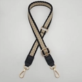 Adjustable woven crossbody strap with black and beige chevron pattern and gold buckles - Black Edge Khaki + Black Leather