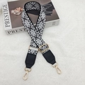 Close-up of ethnic embroidered bag strap with gold metal hooks and leather details - Black Gray Black Leather Gold Hook Bellflower