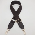 Detail of dark brown woven bag strap with geometric patterns and golden metal buckles - Coffee + Coffee Leather Trim