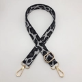 Detail of leopard jacquard strap with gold hardware and lobster clasps for bags - Gold Hook / Spotted White Grey