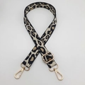 Close-up of adjustable leopard print jacquard strap with polished gold-tone metal clasps - Spotted Khaki