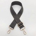 Close-up of adjustable gray guitar-style bag strap with geometric diamond weave and gold hardware - Dark Gray