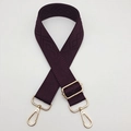 Close-up of deep purple wide woven strap with geometric diamond patterns and gold metal hooks - Deep purple