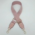 Close-up of pink jacquard replacement strap with geometric pattern and gold hardware - Pink with Pink Trim