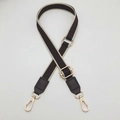 Detail of adjustable geometric jacquard shoulder strap with brown leather and gold buckles - Dark Coffee + Coffee Leather