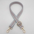 Detail of adjustable woven nylon strap in pink and grey with gold metal hooks - Grey Base Pink Bow