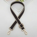 Detail view of jacquard woven geometric strap with golden lobster clasps and sliding buckle - Gold Hook / Beige Edge Dark Coffee