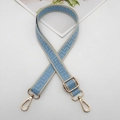 Close-up of adjustable woven bag strap with blue geometric patterns and gold metal hooks - Gold Hook / Beige Edge Light Blue
